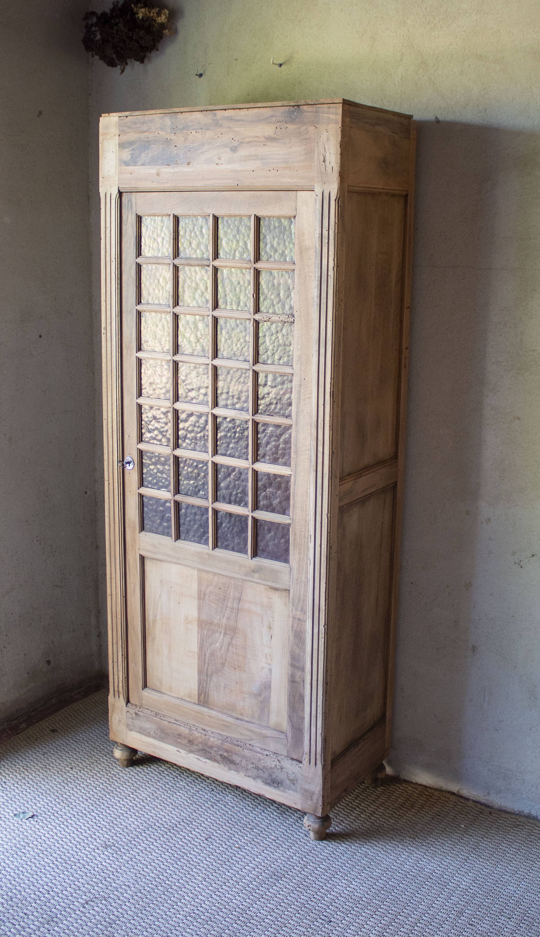Glass-fronted cabinet from 1915, solid wood.