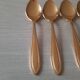 Small golden metal spoons