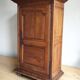 Louis XIII oak wardrobe, bonnetière, 18th century.