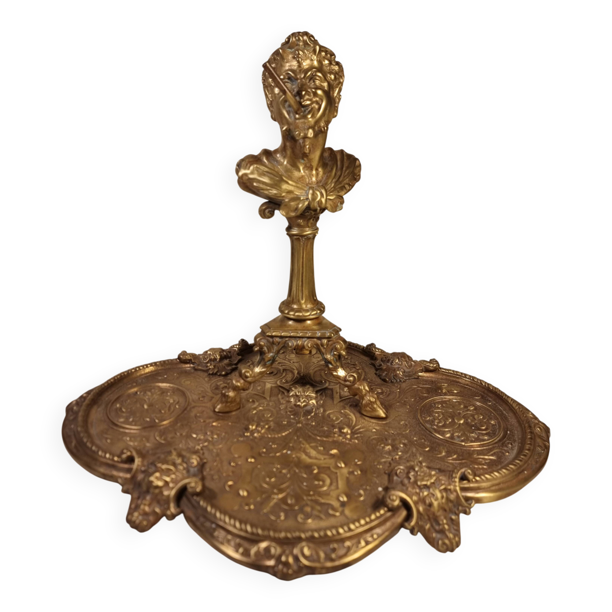 An antique bronze cigar lighter.