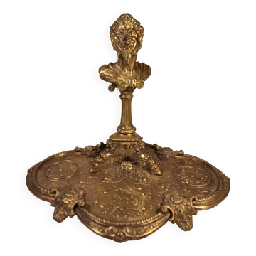 An antique bronze cigar lighter.