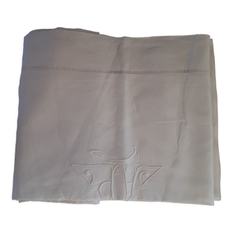 Cotton sheet with days and hand-embroidered monogram.