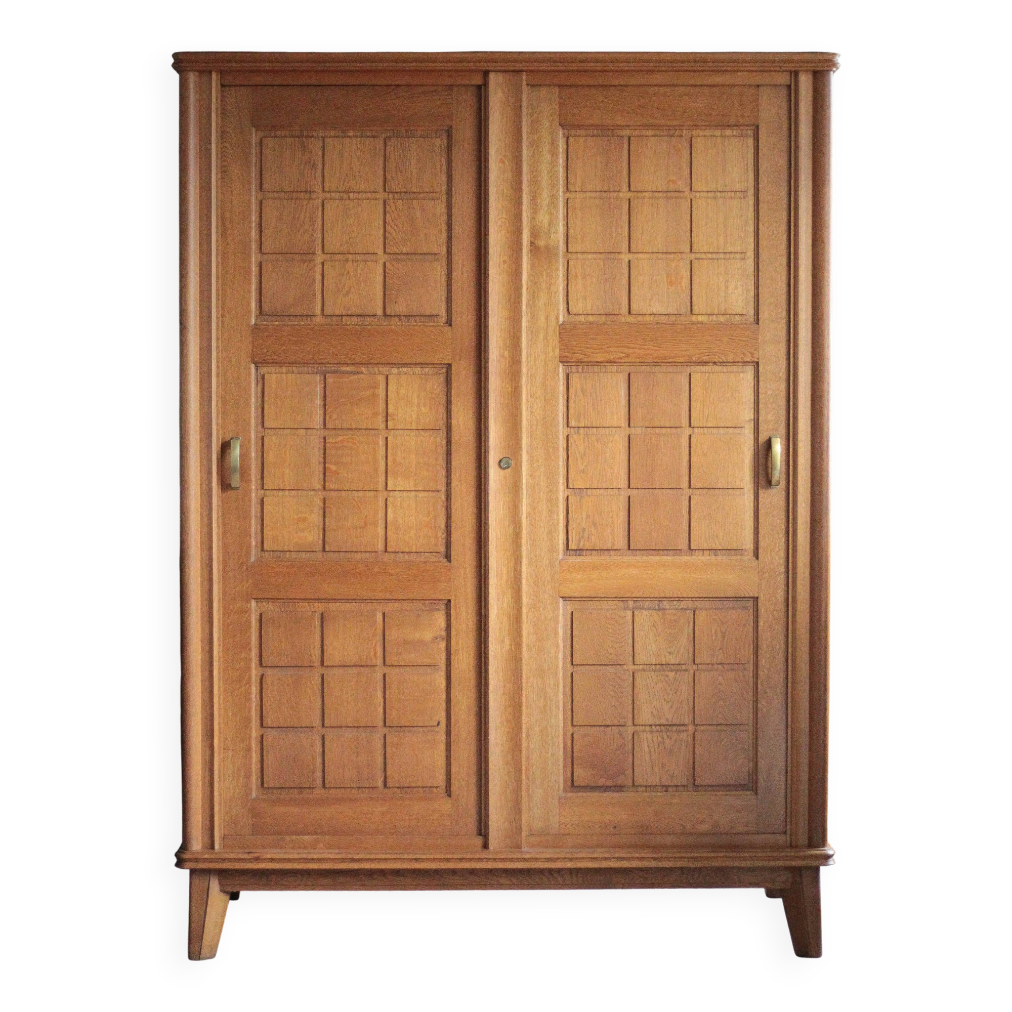 Vintage wooden wardrobe with sliding doors.