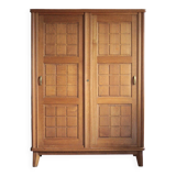 Vintage wooden wardrobe with sliding doors.