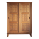 Vintage wooden wardrobe with sliding doors