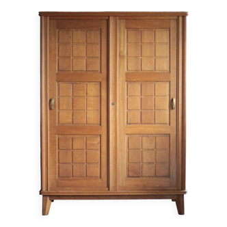 Vintage wooden wardrobe with sliding doors.