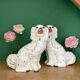 Pair of Staffordshire-type dogs in white and gold ceramic