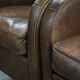Elegant set of two sheepskin leather armchairs with beautiful round shapes