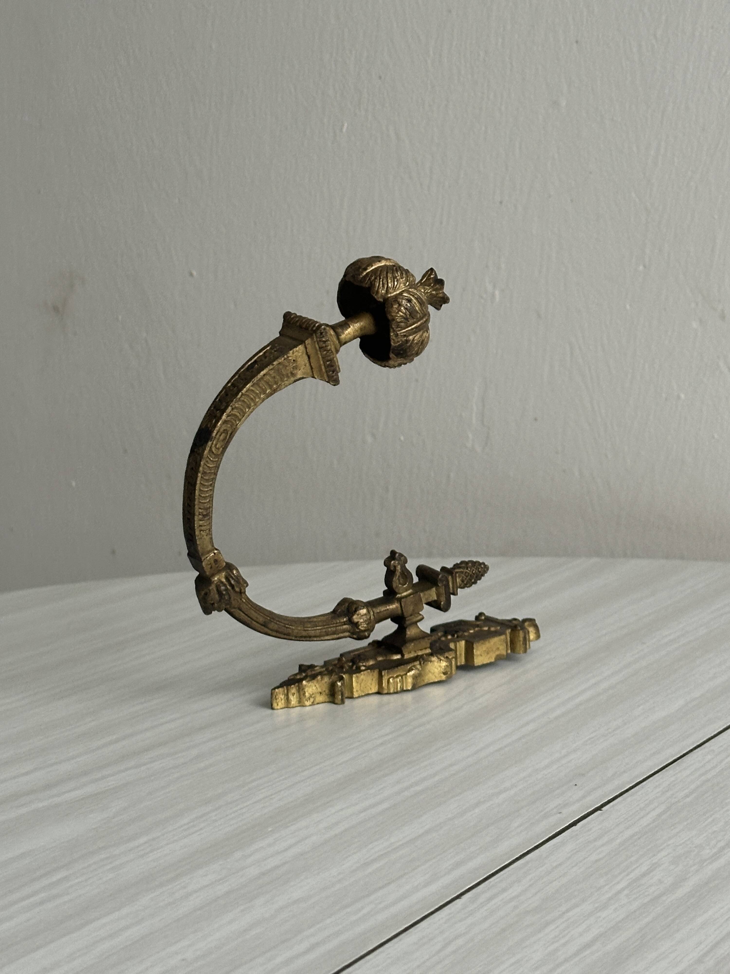 antique wall hook, gilded sculpted metal