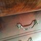 Commode Louis Philippe bois et marbre noir, 4 tiroirs
