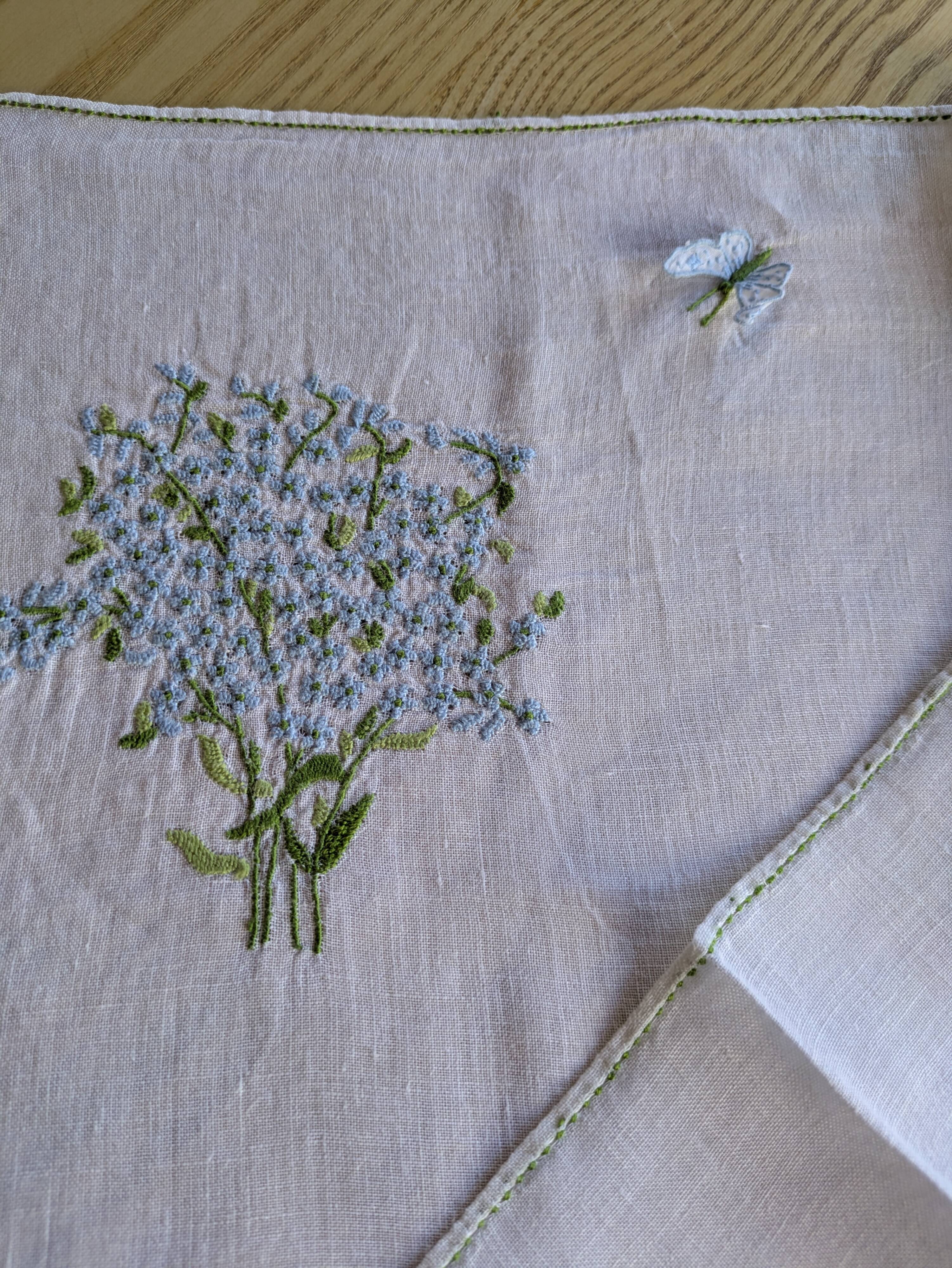 Hand-embroidered table duo in linen voile – Azure Bouquet & Butterfly