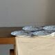 Set of 10 flat plates in Limoges porcelain from France with flowers.