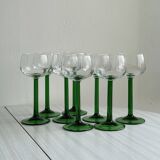 8 Alsatian stemmed glasses, transparent glass and green stems.