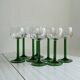 8 Alsatian stemmed glasses, transparent glass and green stems.