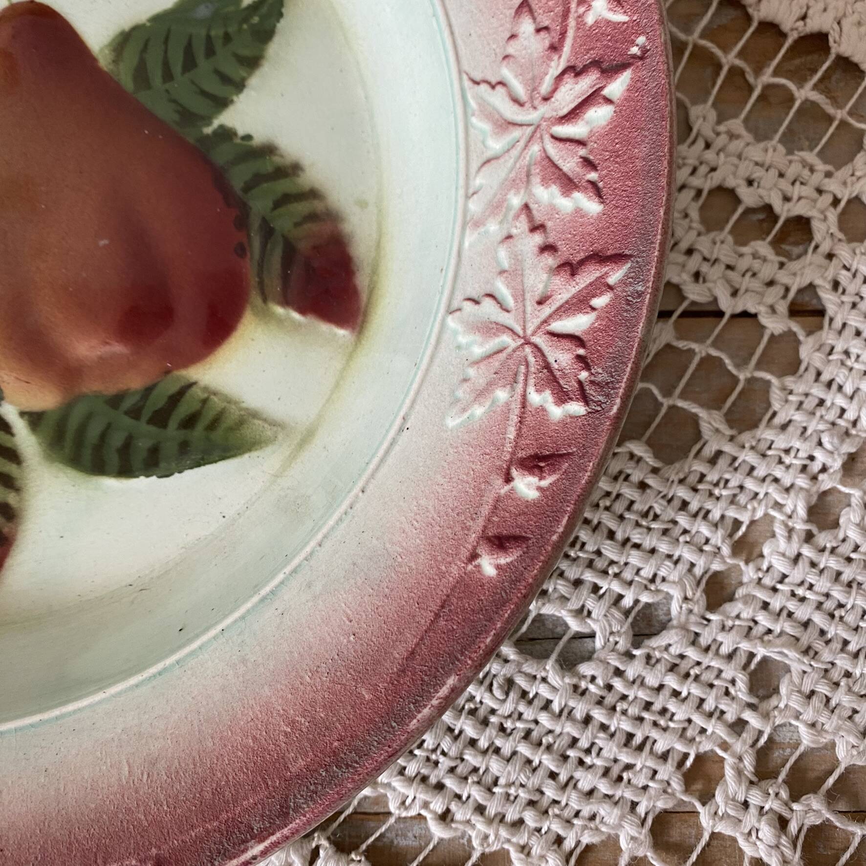 Antique shallow dish in slipware with pear decoration.