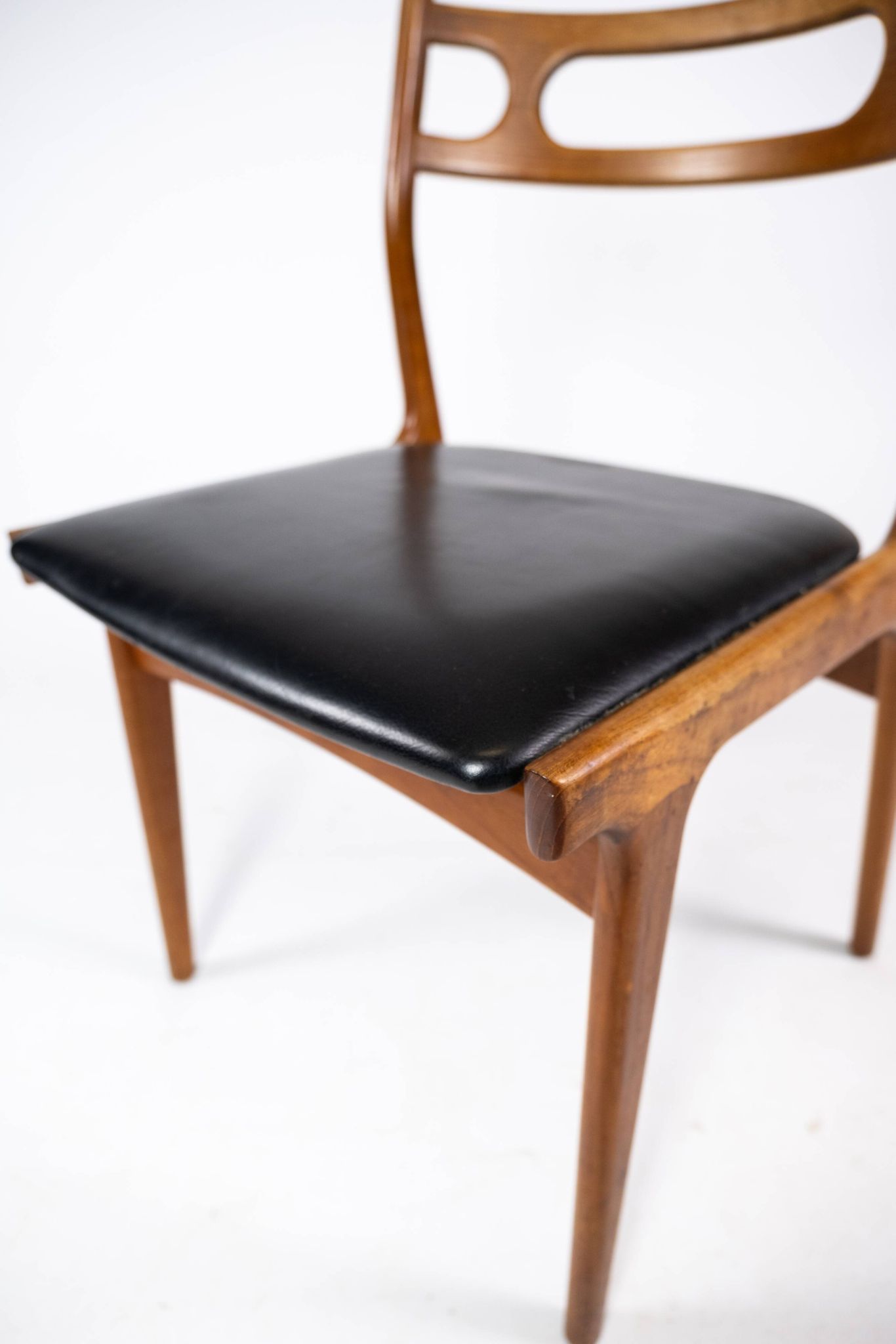 A set of four dining room chairs of teak of danish design, 1960s