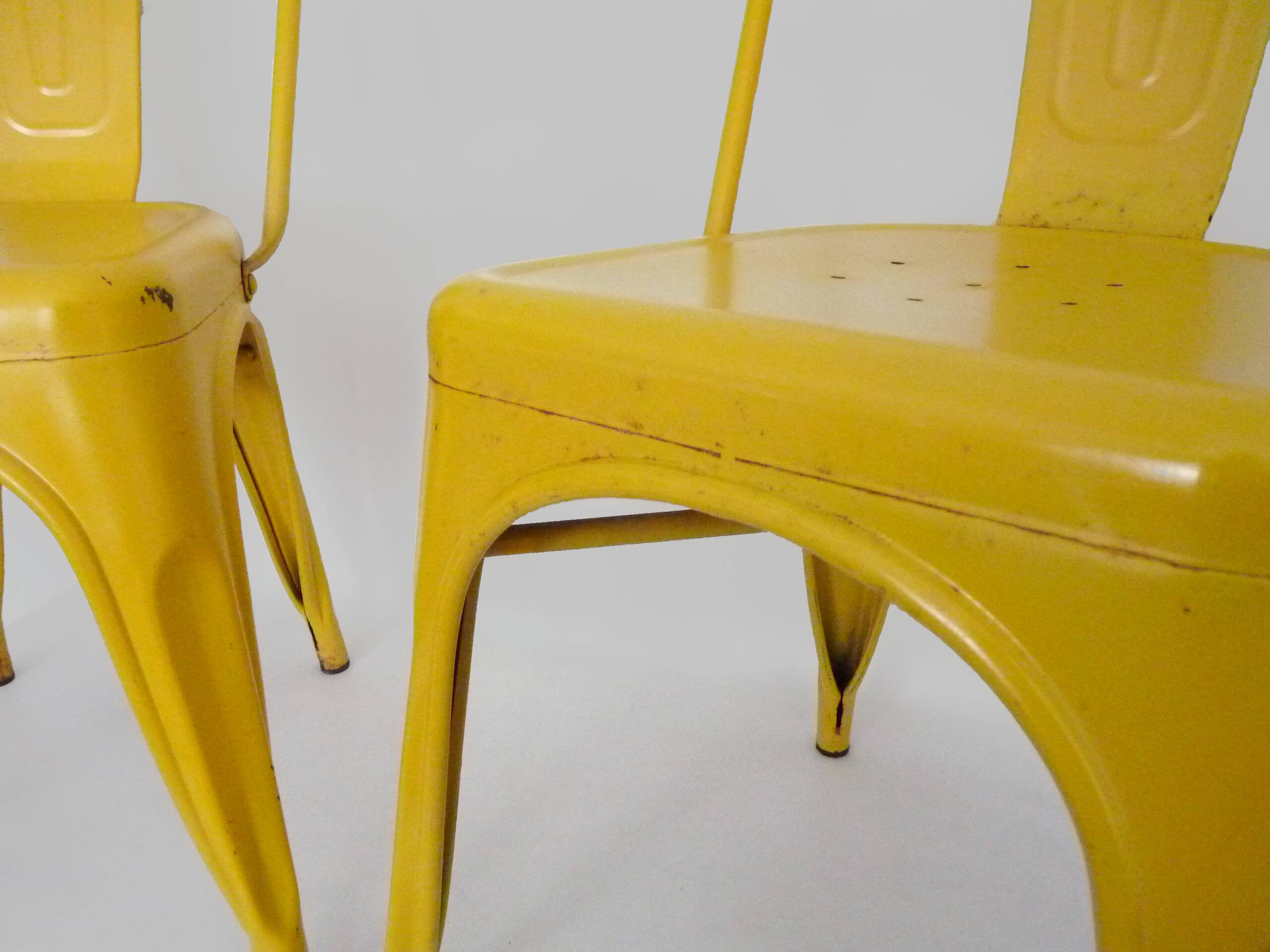 Pair of Tolix Chairs in yellow metal by Xavier Pauchard
