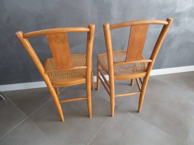Pair of old caned chairs in blond wood