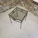 Petite table d'appoint en fer forgé et verre fumé
