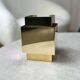 Cubical brass wall light