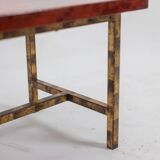 Table basse en laque et fer doré. Années 1950.