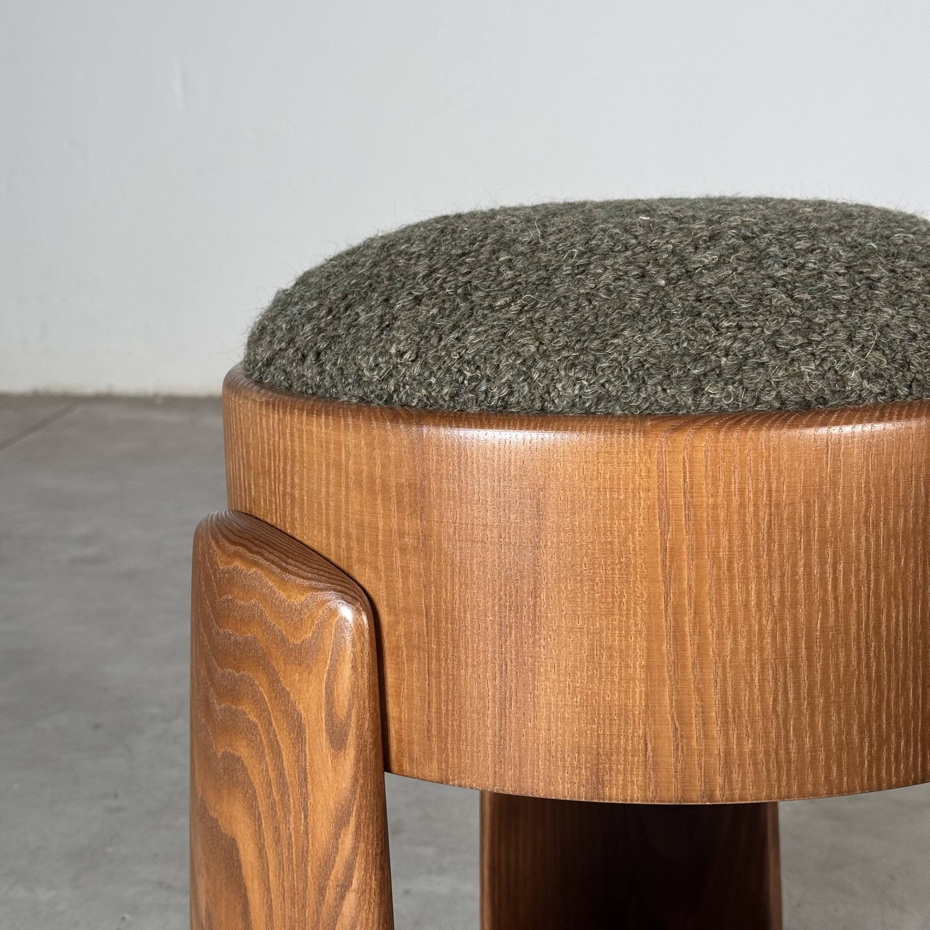 Sculptural pair of ash wood stools with dedar milano bouclé