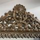 Small mirror with brass parcloses in repoussé style Louis XIV, late 19th century.