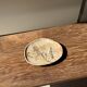 Small beige oval petrified wood dish or tray with crystals.