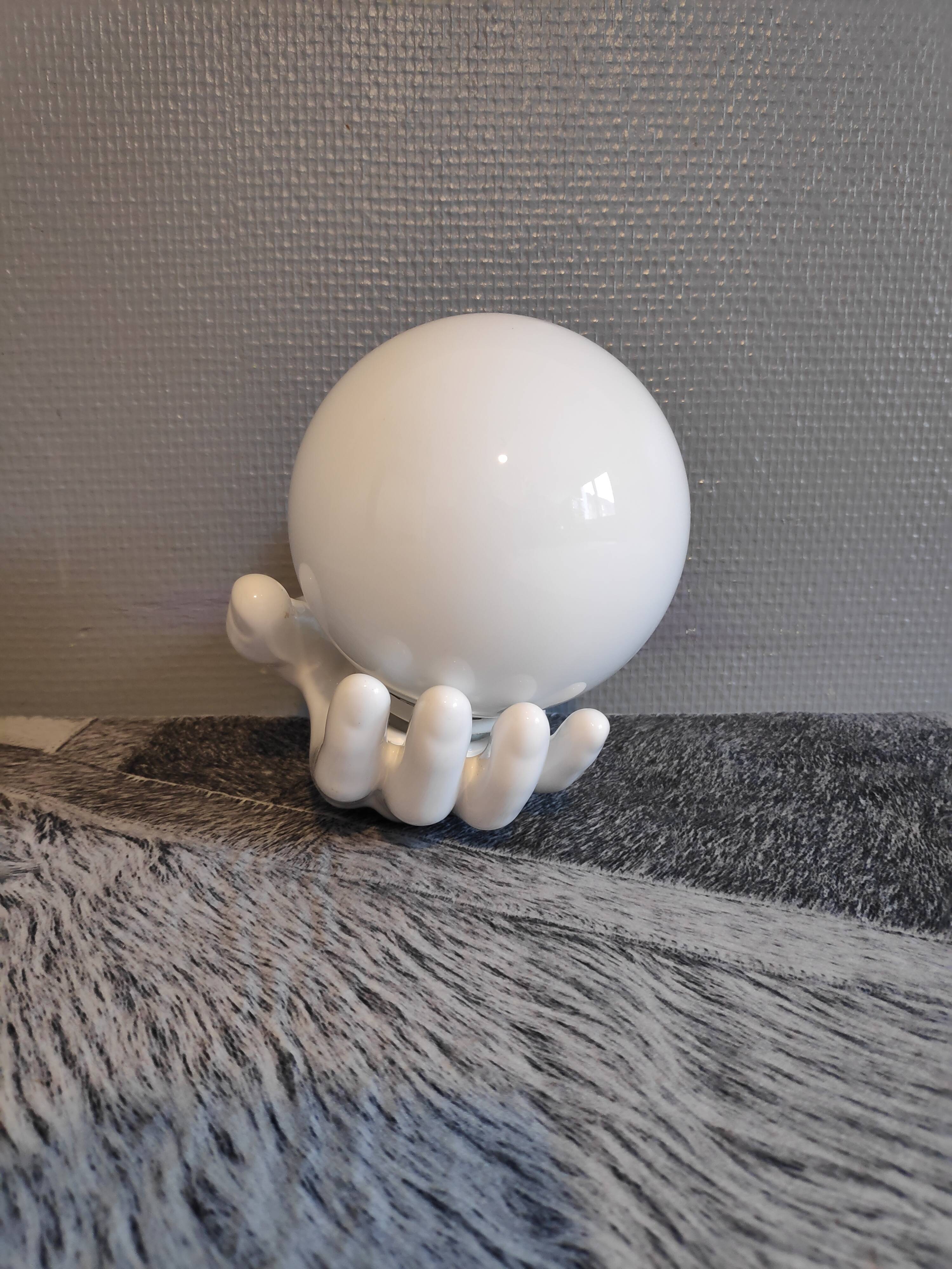 White ceramic hand sconce with white opaline globe