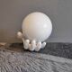 White ceramic hand sconce with white opaline globe