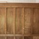 Old solid wood wardrobe with three vintage mirror doors