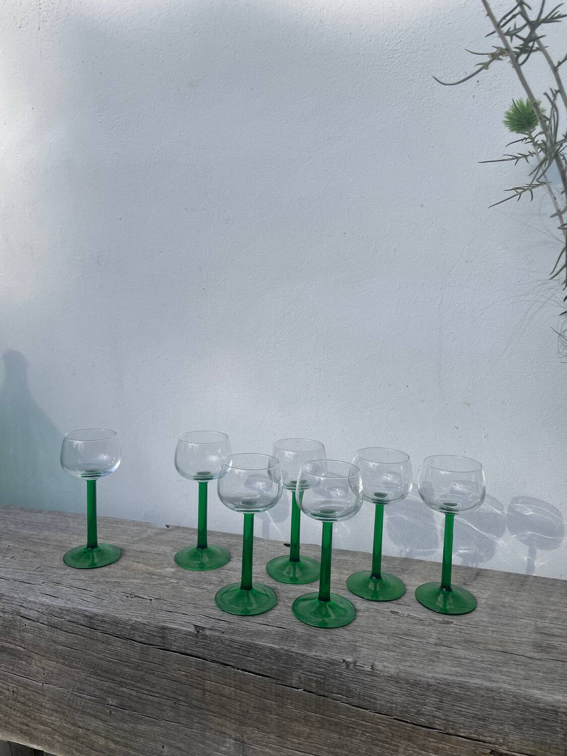 7 green glass stemmed glasses