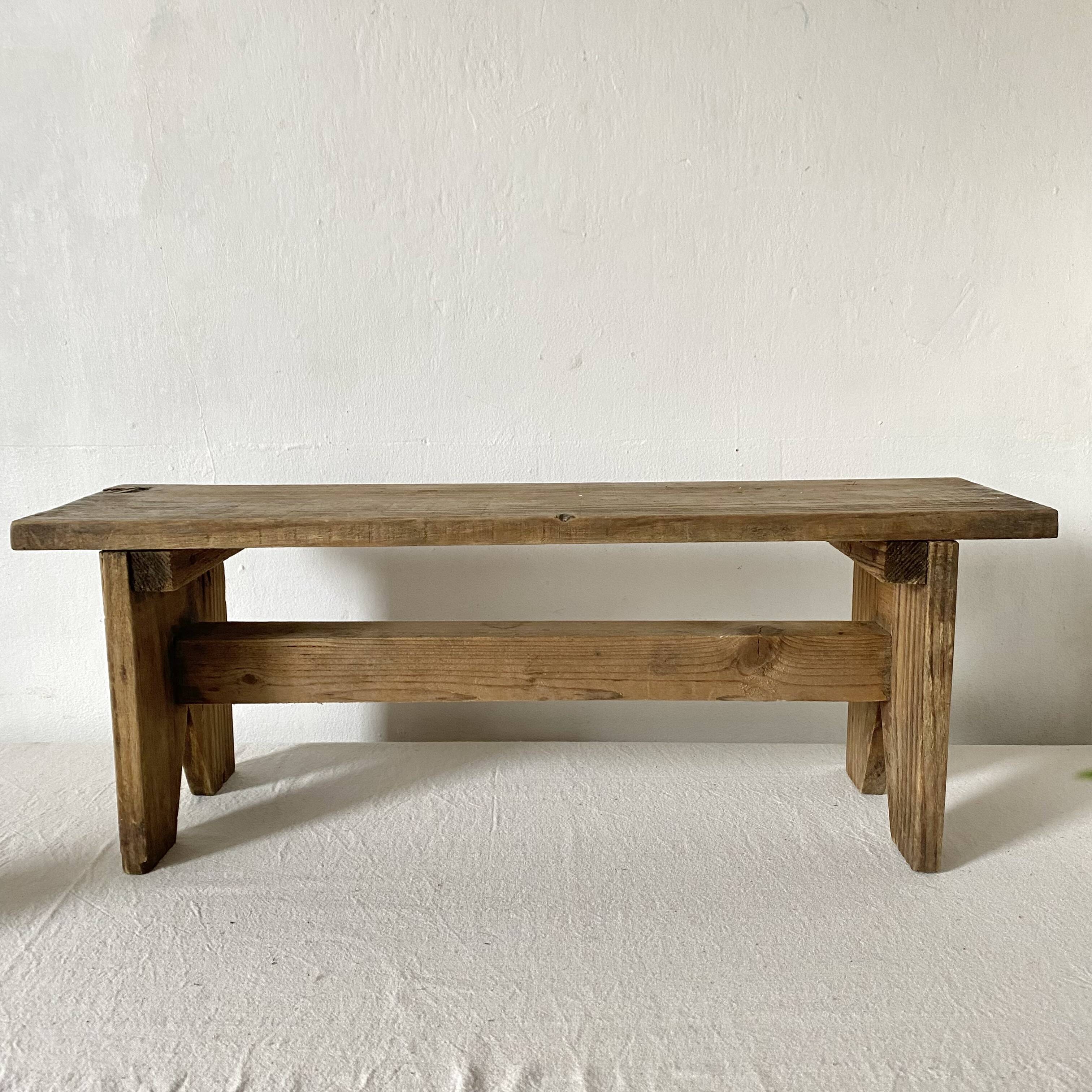 Low stool in raw wood