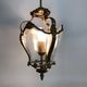 Old lantern with 3 faces, chandelier in gilded bronze and curved glass. Year 60