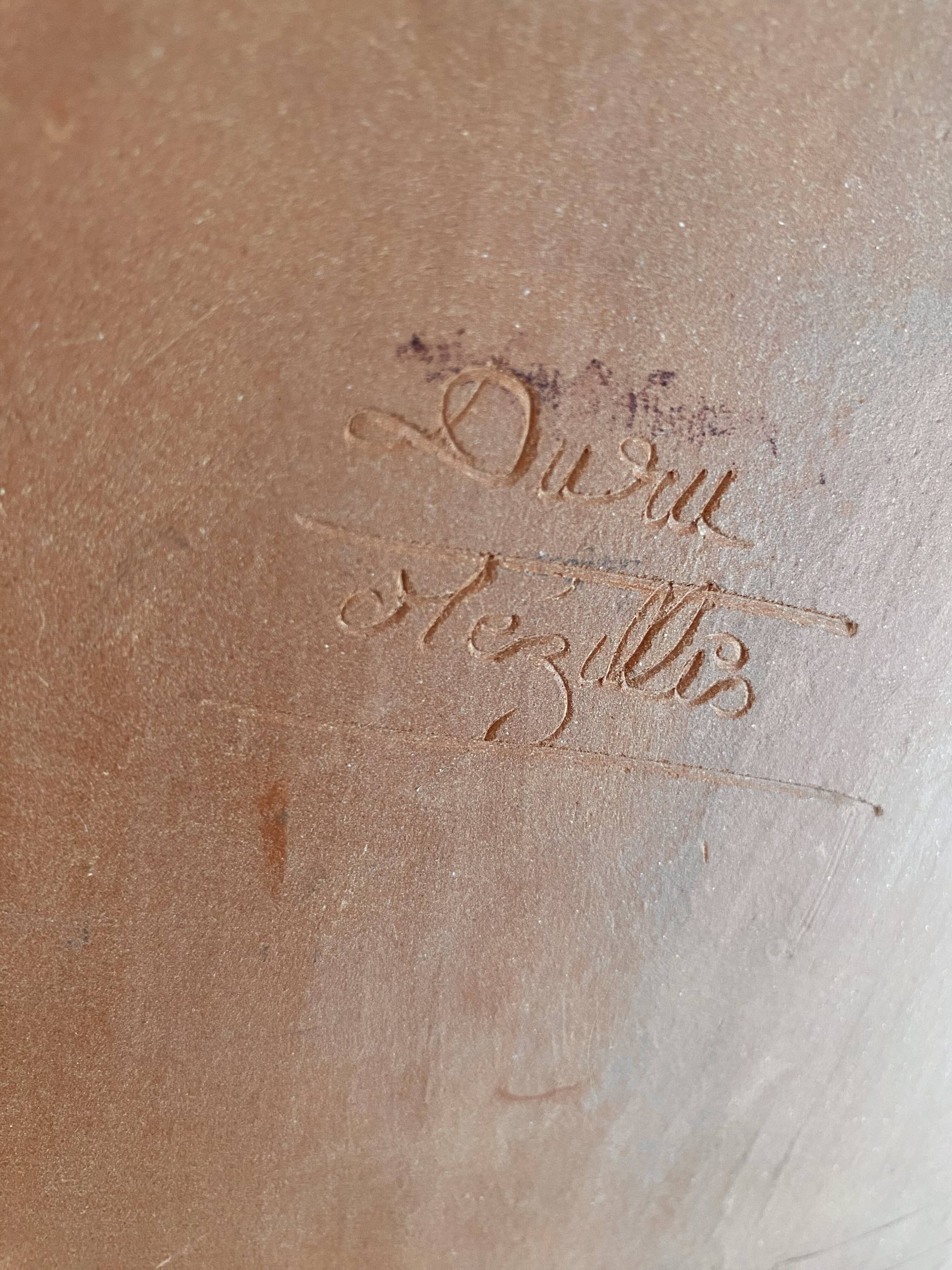 Plat terre cuite émaillée signée