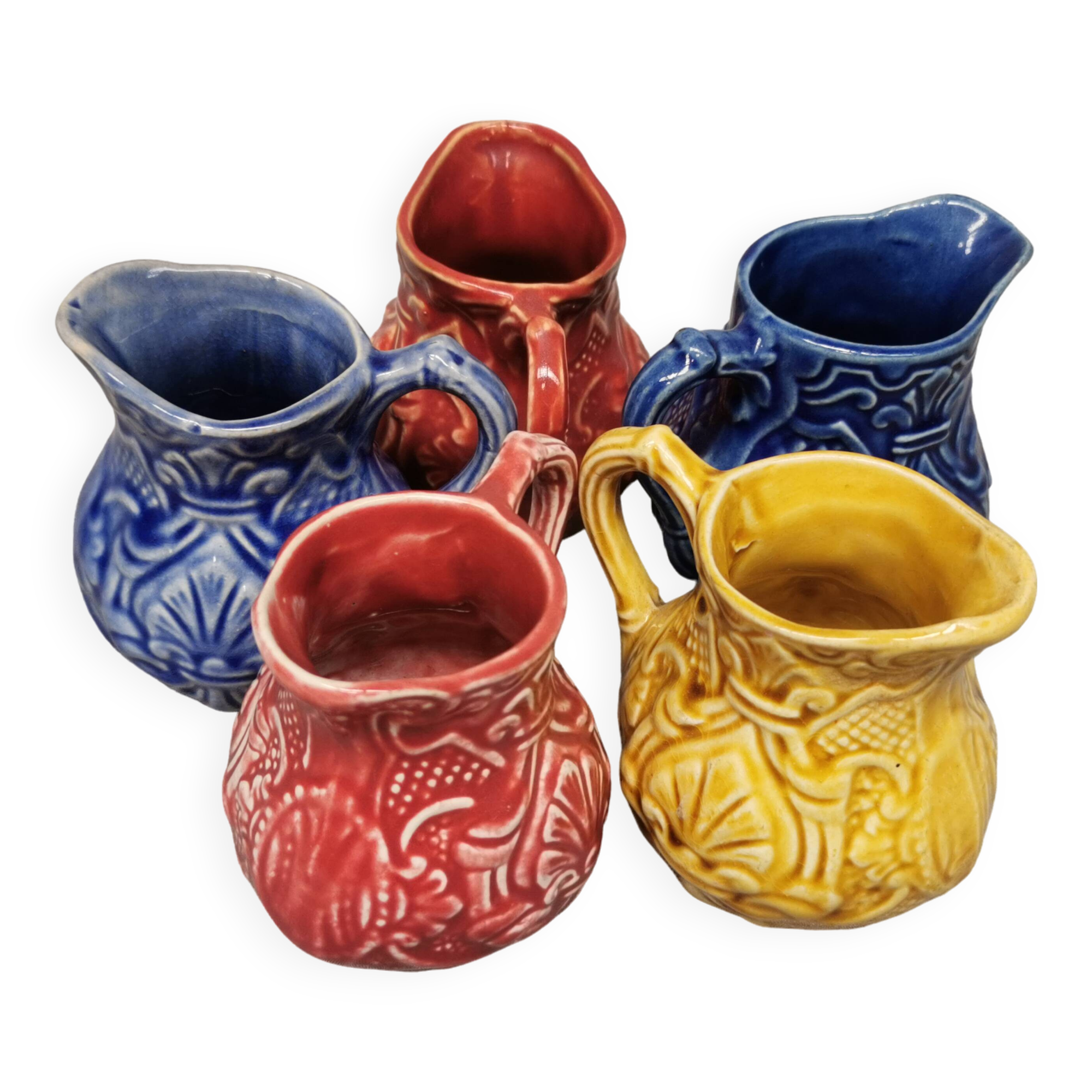 Set of 5 old onnaing barbotine jugs. creamer, sauce boat