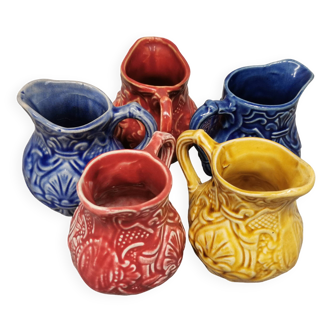Set of 5 old onnaing barbotine jugs. creamer, sauce boat