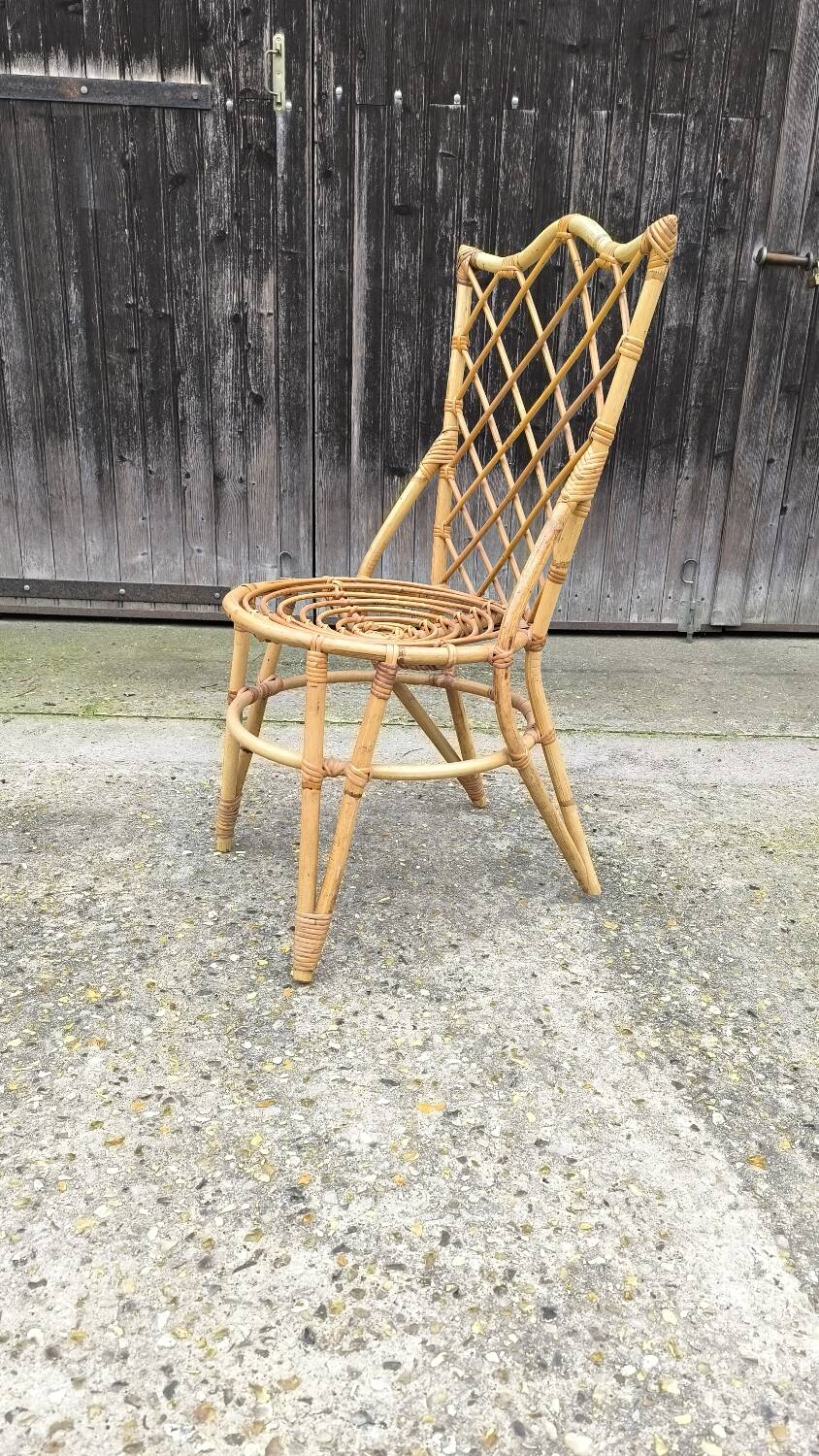 Rattan chair by Louis Sognot 1960