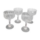 Four glasses of carved crystal champagne
