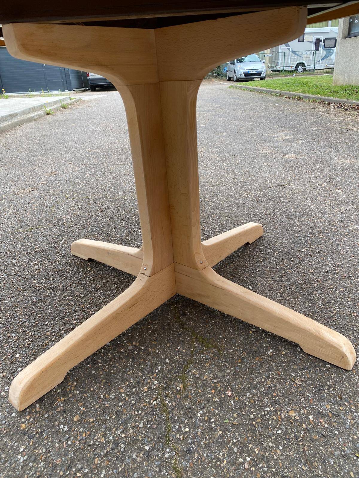 Scandinavian Baumann round extendable dining table with central leg, 115cm.