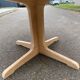 Scandinavian Baumann round extendable dining table with central leg, 115cm.