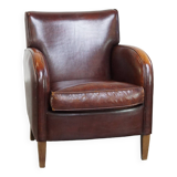 Subtle sheep leather armchair with a beautiful finish and a good patina