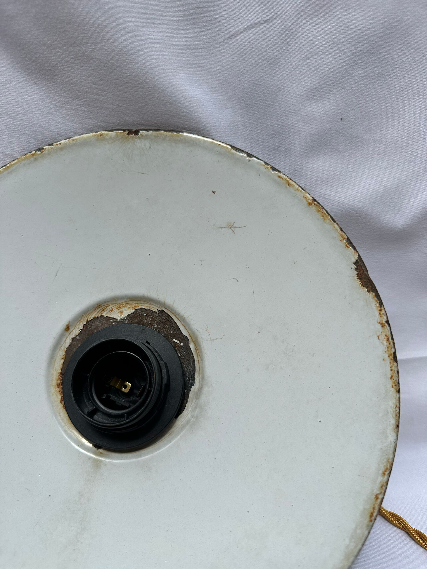 Old green and white enamelled sheet metal suspension