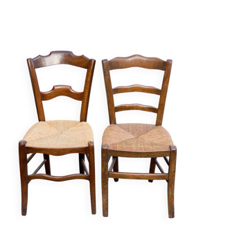 2 solid oak carved and rush-seated chairs in the Louis Philippe style, 19th century.
