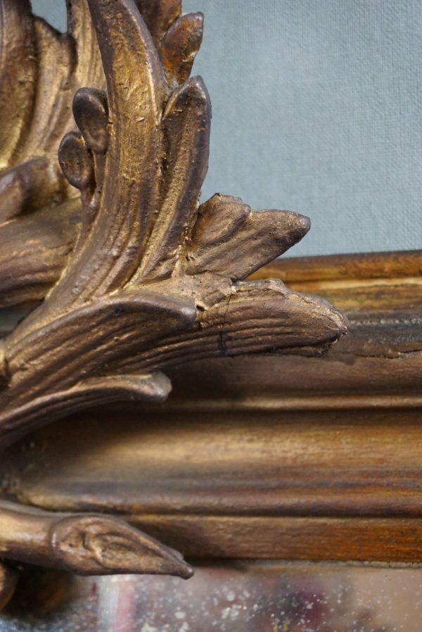 Old French fireplace mirror with beautiful ornament
