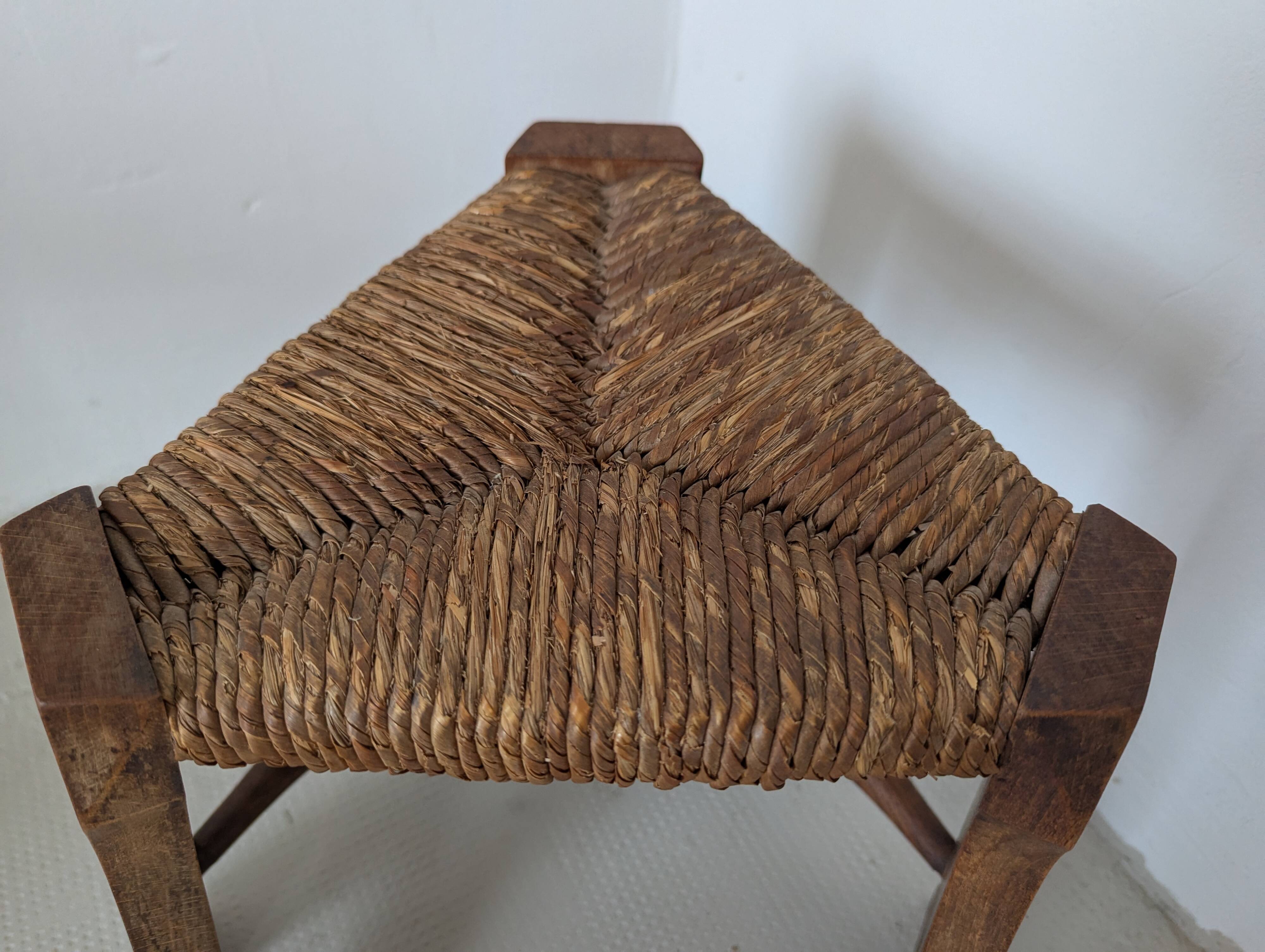 Low tripod farm stool in wood and straw