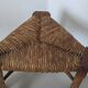 Low tripod farm stool in wood and straw