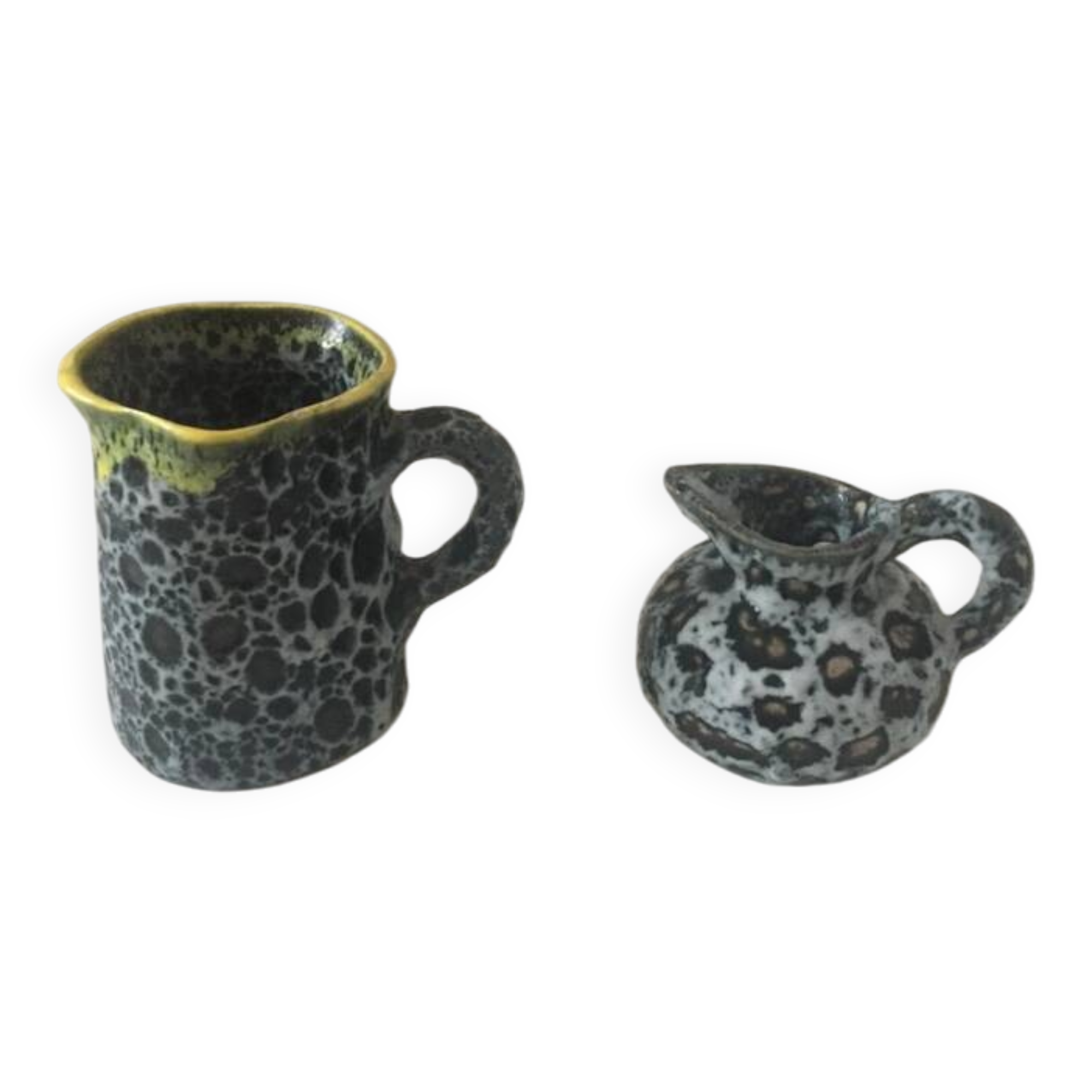 Set of two small Vallauris yellow and black milk jugs