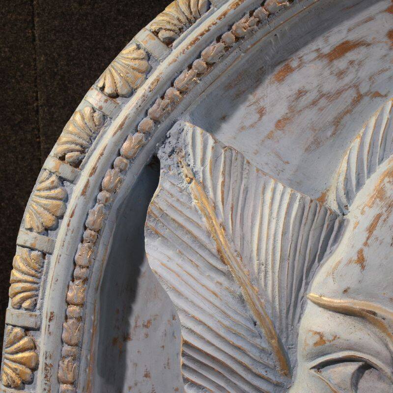 Bas-relief sculpture, stylized face with flowers, 20th century