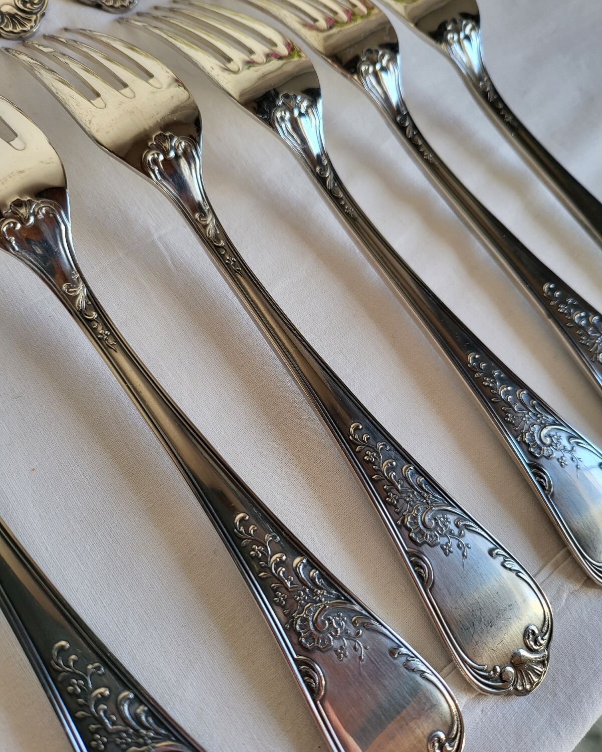 12 large silver-plated metal table forks by Guildart